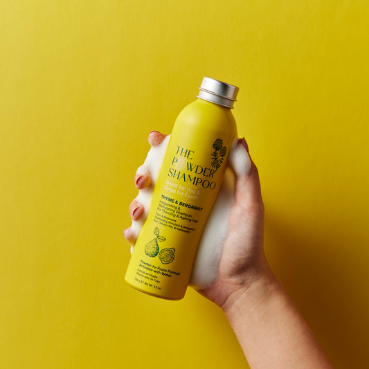 A white cosmetic jar of OOTD Snail Mucin Lifting Cream with advanced anti-aging benefits and moisturizing excellence.