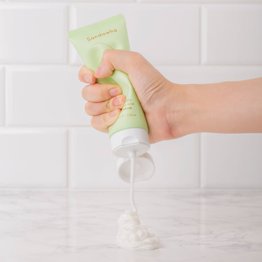 A cream-colored tube of Naked Chemist SunJuice tinted sunscreen providing sheer coverage with UV defense.