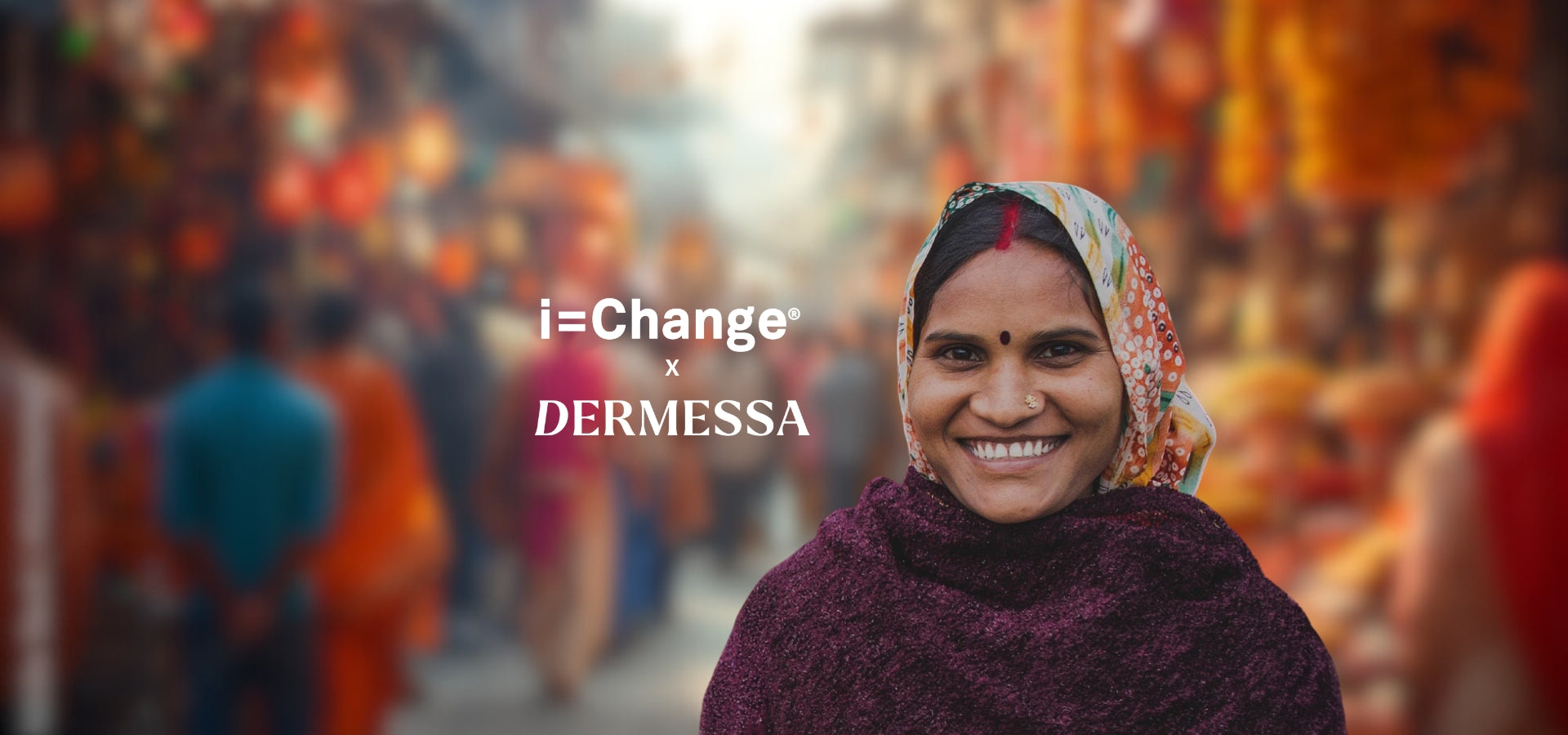 An smiling Indian woman in a market