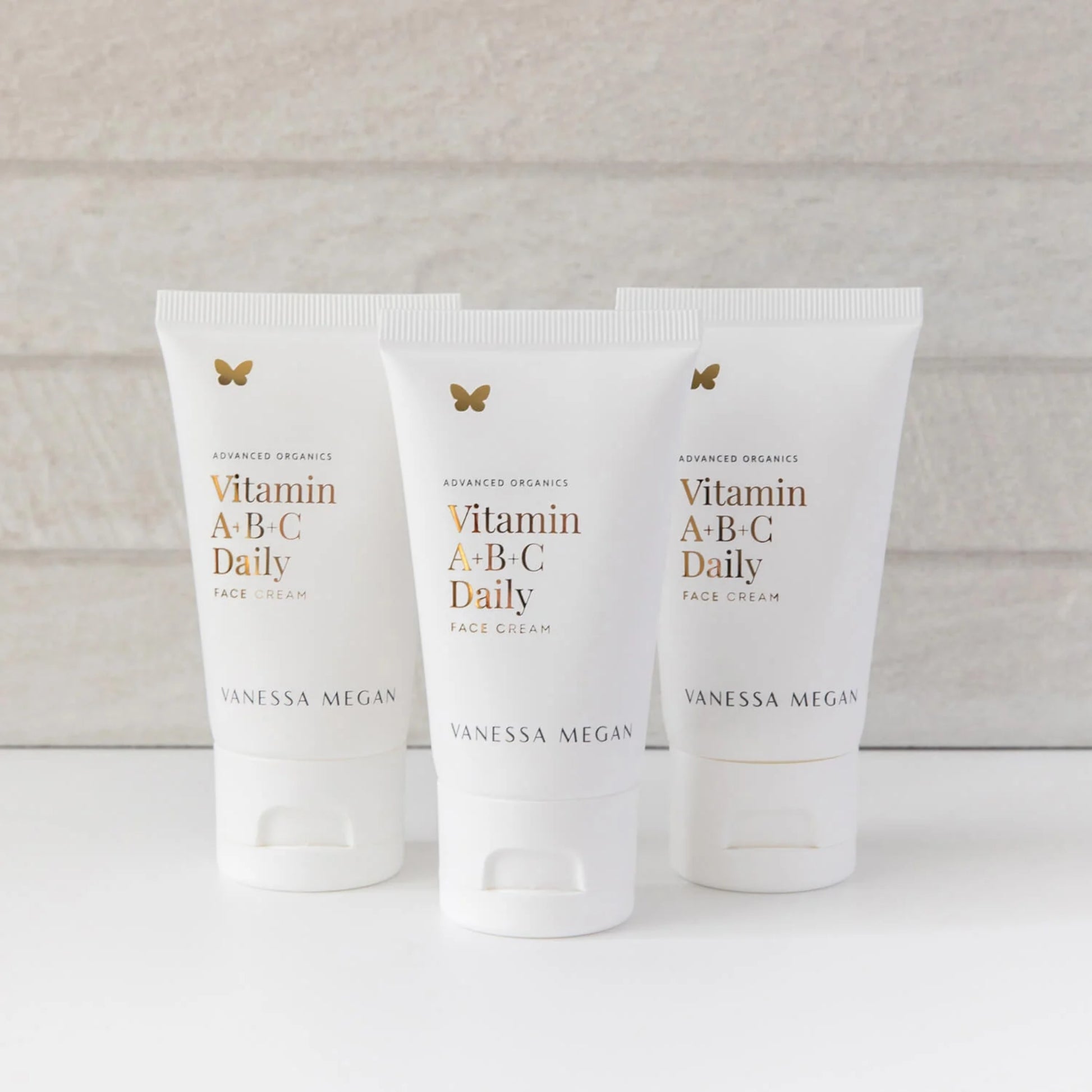 Three tubes of Vitamin A-B-C Daily Face Cream by Vanessa Megan on a light background
