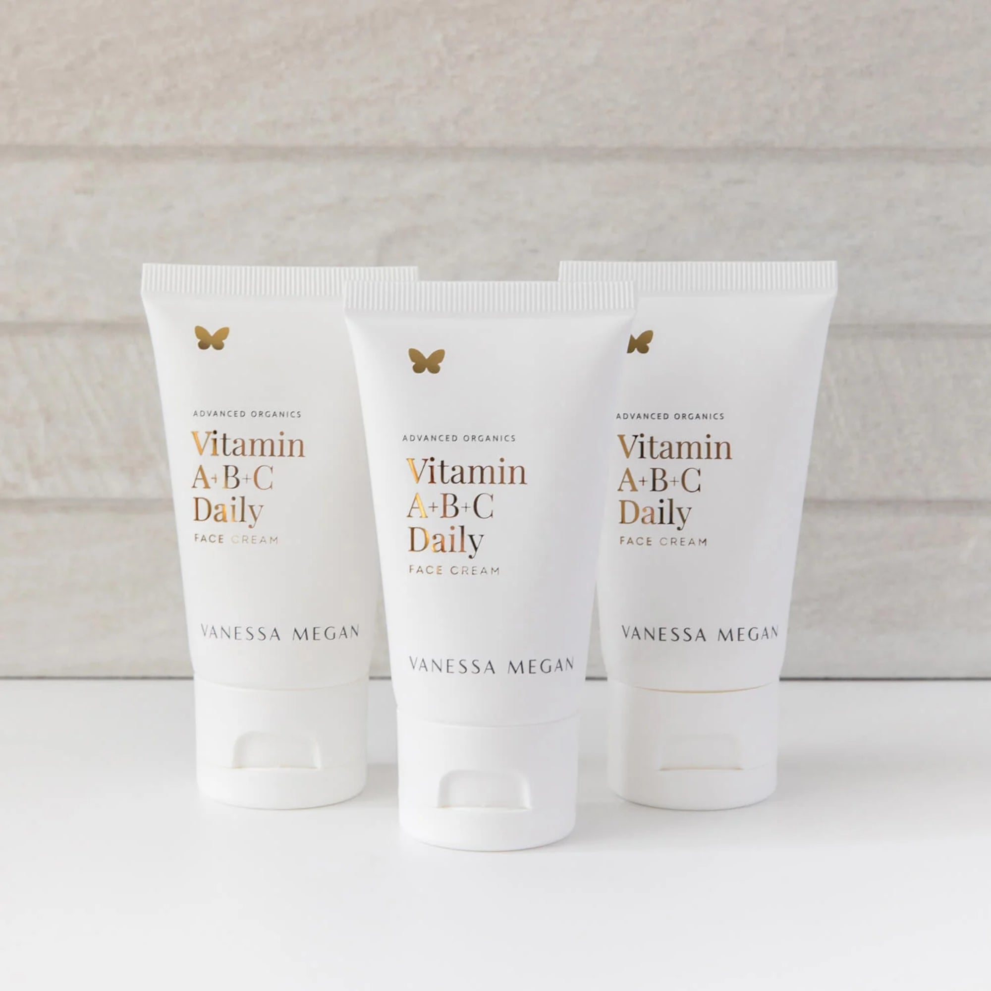 Three tubes of Vitamin A-B-C Daily Face Cream by Vanessa Megan on a light background