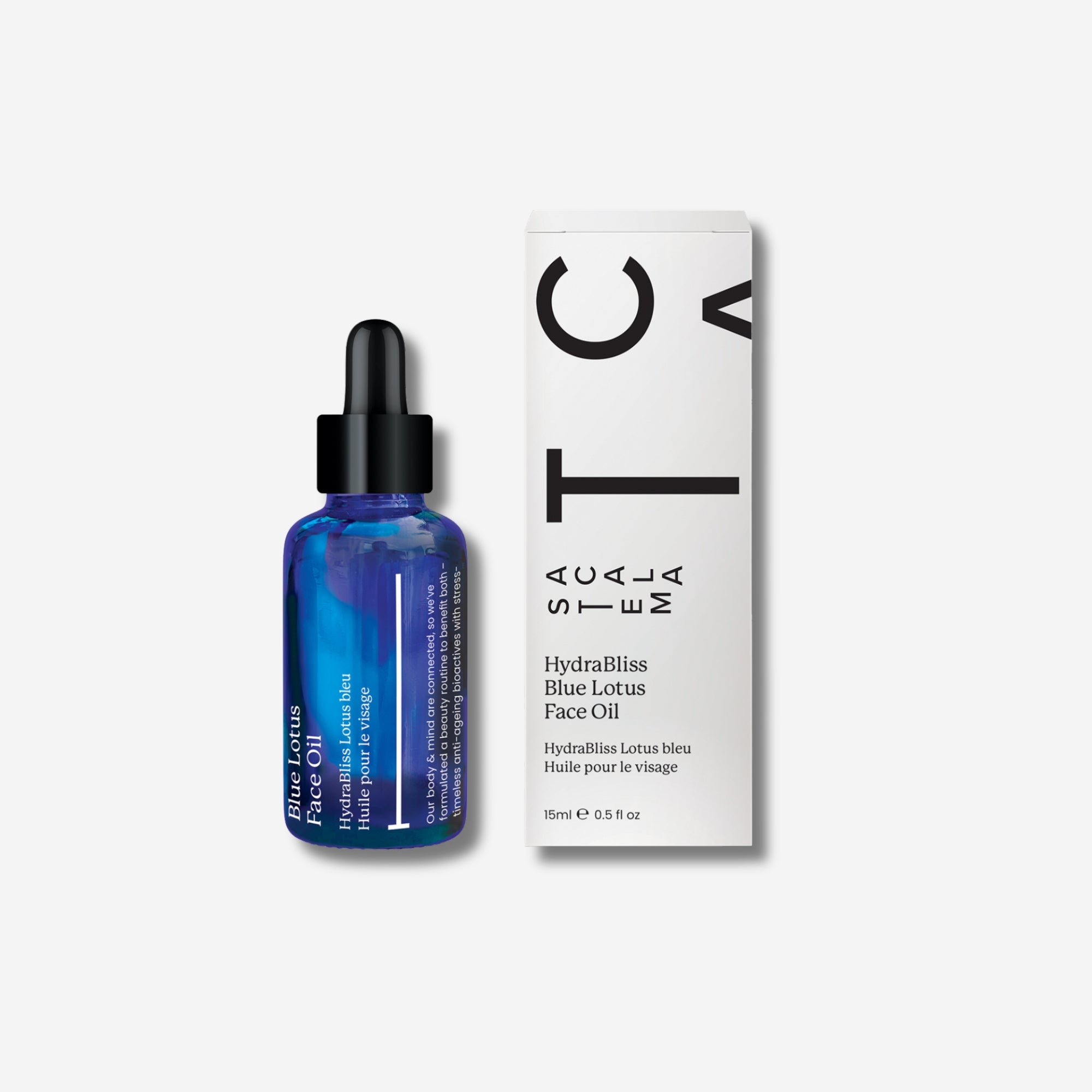 Blue bottle of Acala Stem Hydabliss Blue Lotus Face Oil with white box on a light grey background