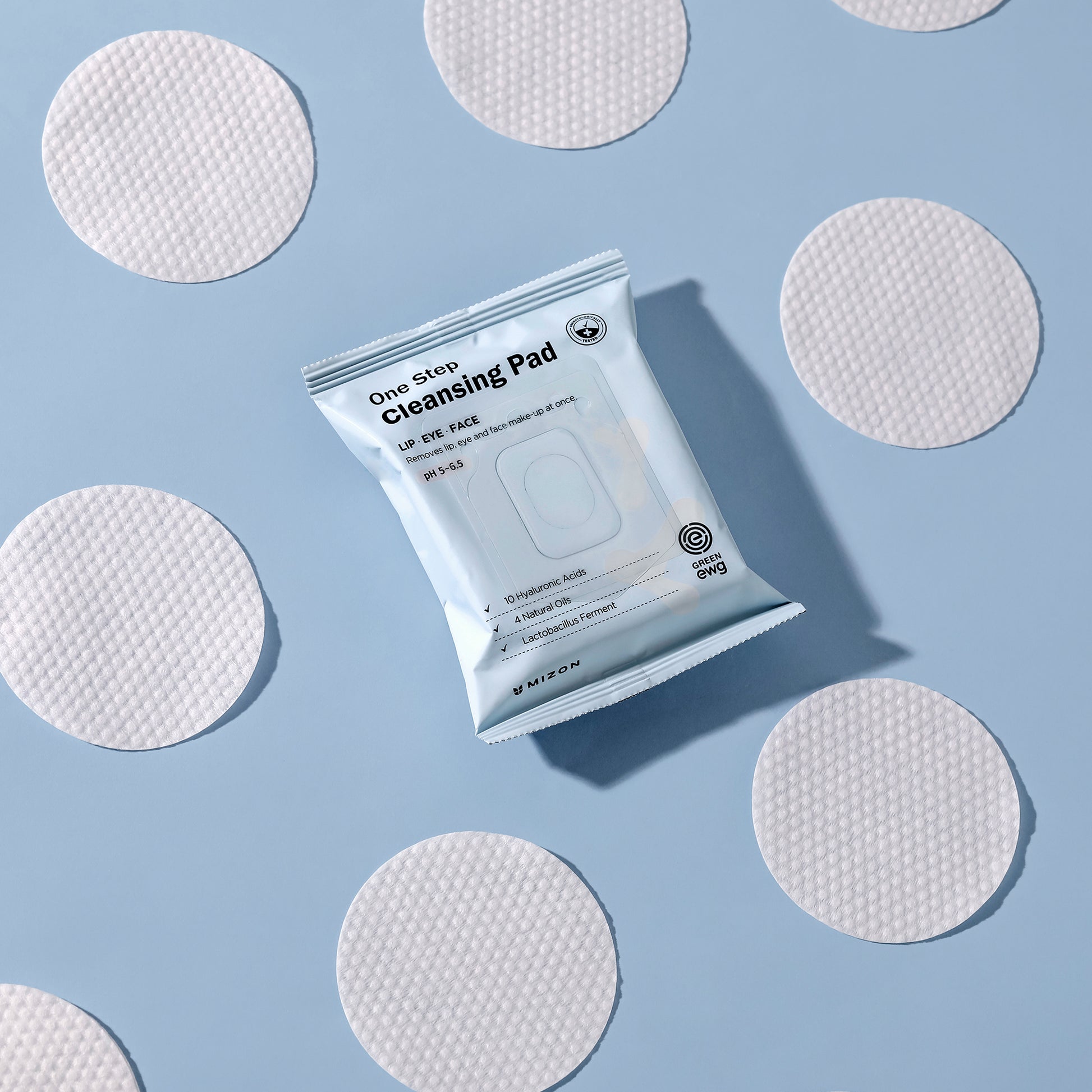 Mizon One Step Cleansing Pad with textured pads on blue background for face cleansing.