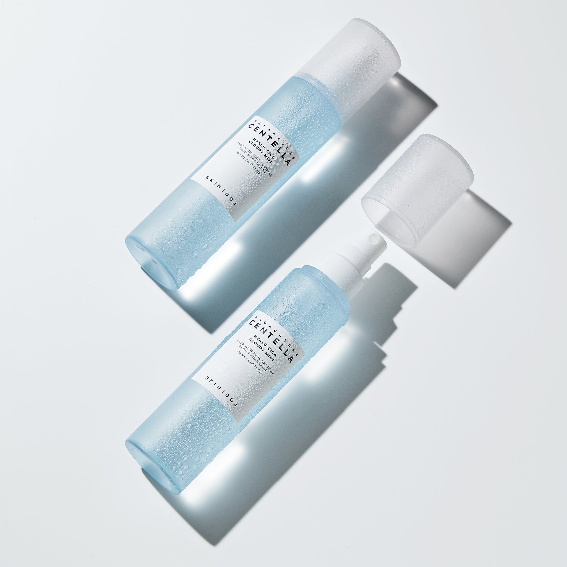SKIN1004 Madagascar Centella Hyalu-Cica Cloudy Mist spray bottles on a white background.