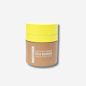 A bottle of Face Barrier SPF50, labeled as a skin tint primer, with a yellow lid and brown body, on a white background.