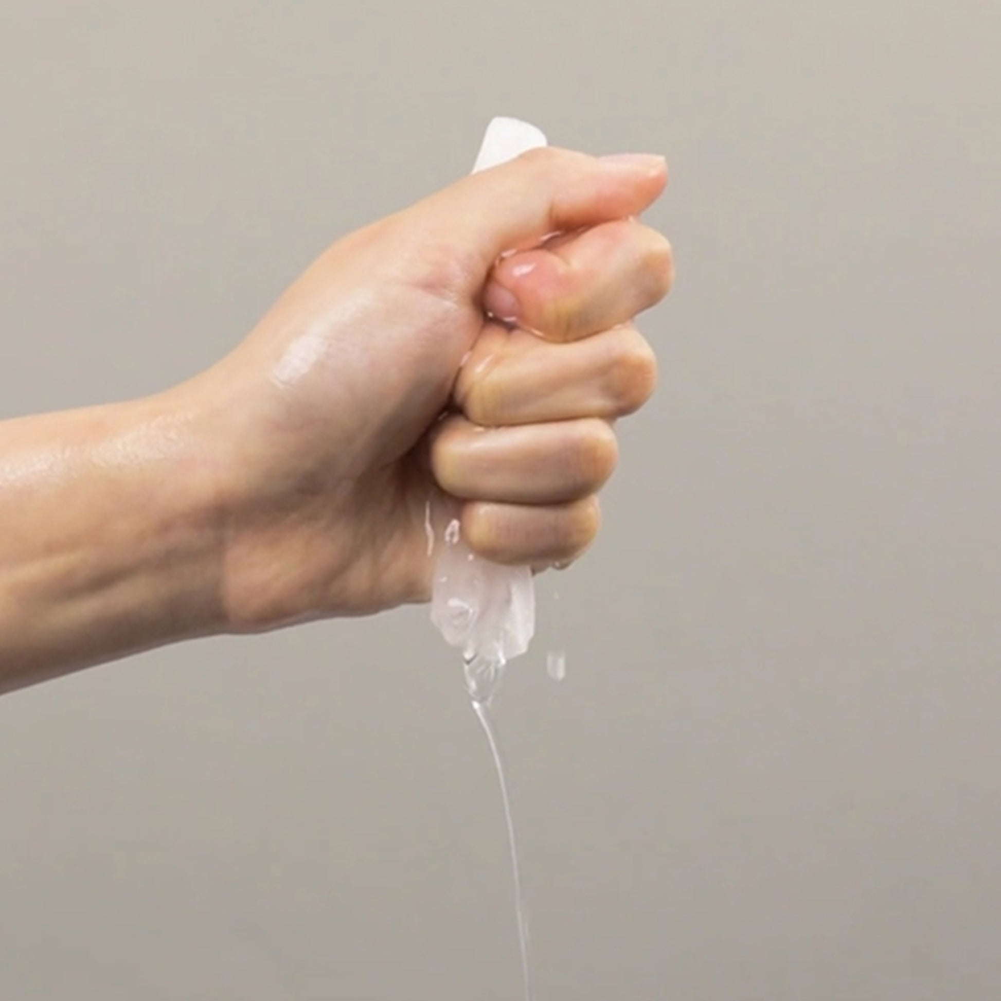 Hand squeezing fermentation mask showing hydration effect from mask pack by brand name.