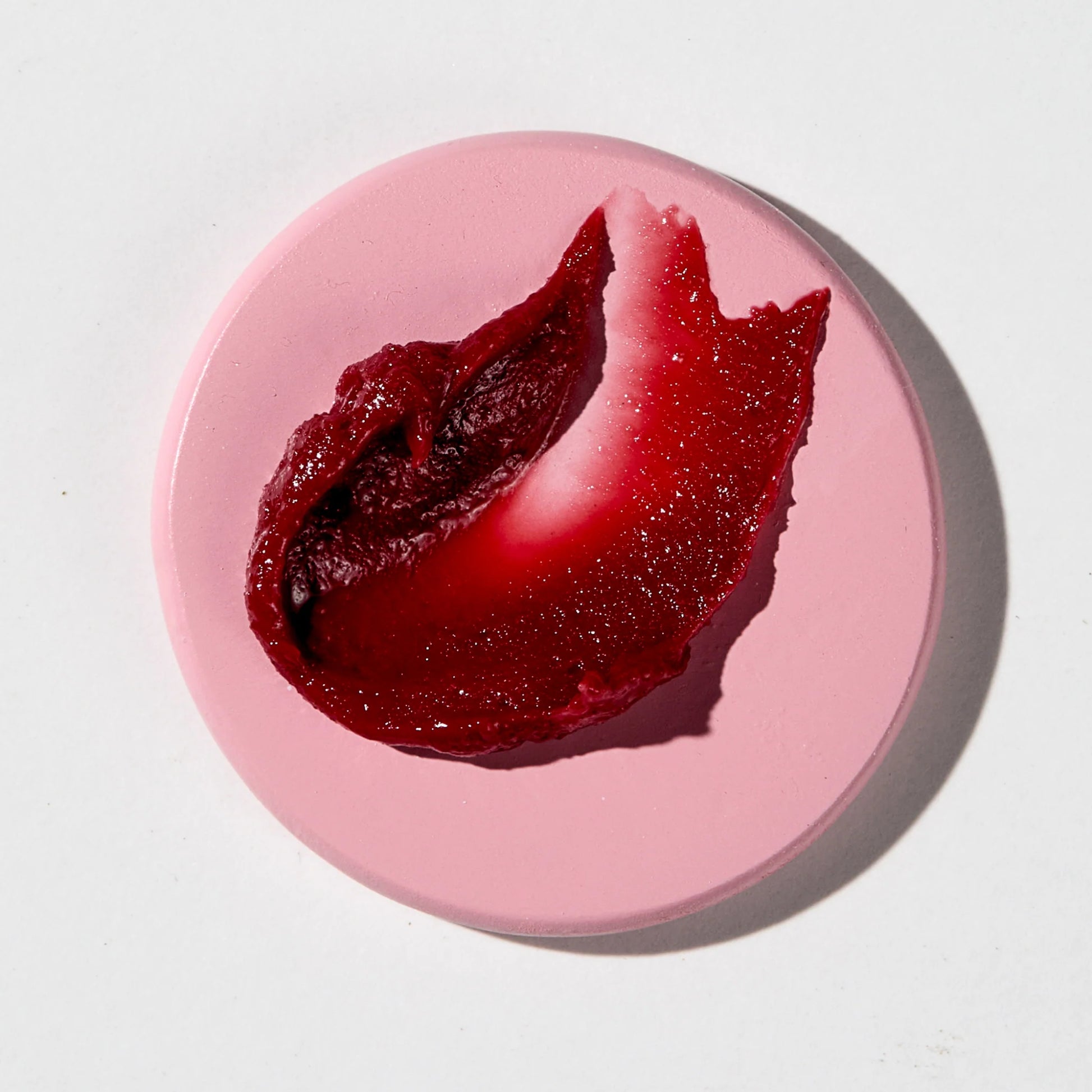 Vanessa Megan Glowing Lip & Cheek Tinted Balm on a plate with white background