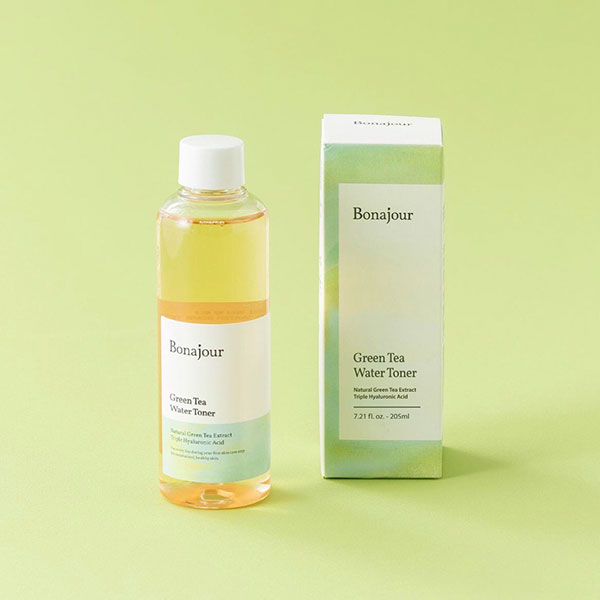 A bottle and box of Bonajour Green Tea Water Toner on a light green background. The bottle is clear with a white and green label, and the box is light green with similar labeling.