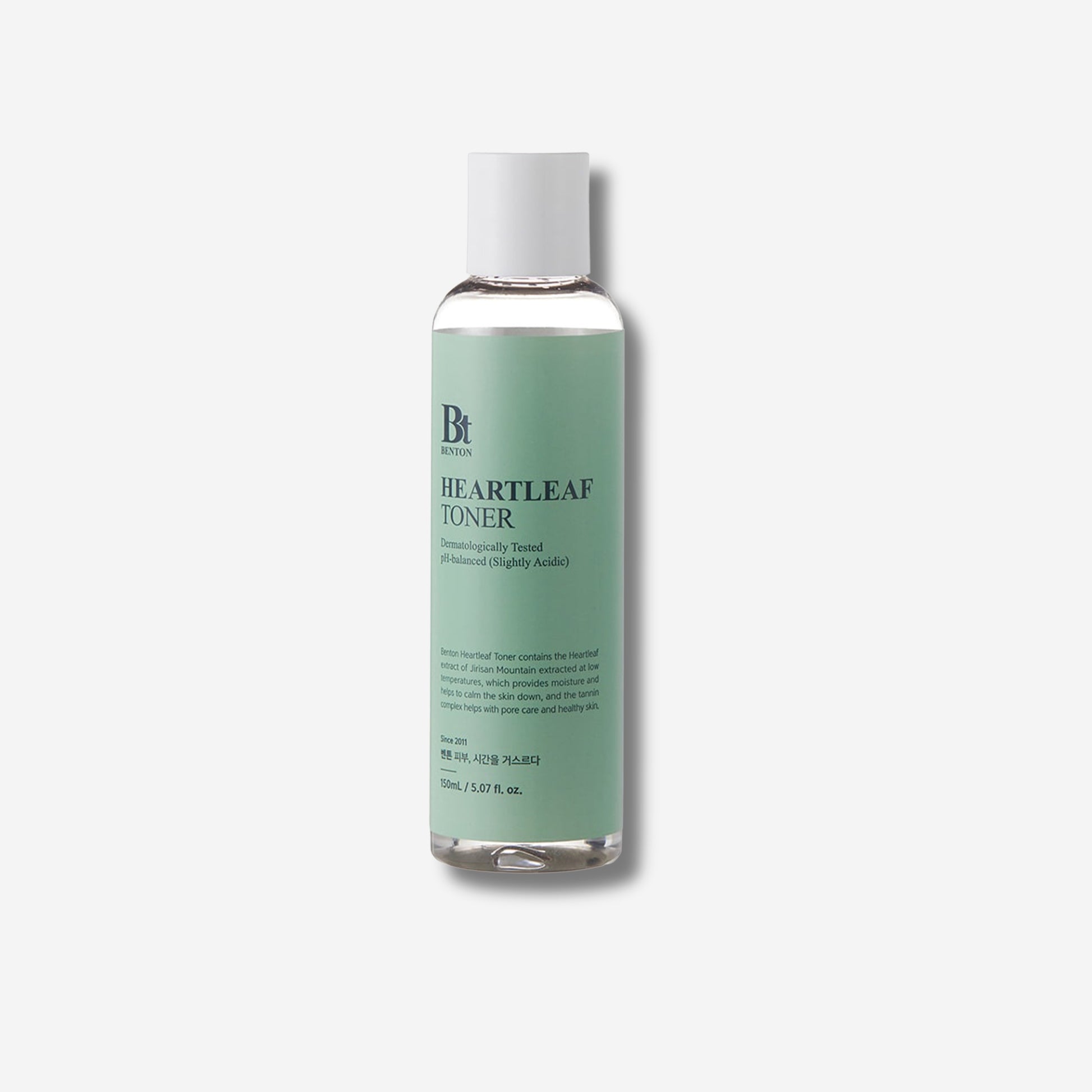 Benton Heartleaf Toner bottle with green label, dermatologically tested and pH-balanced for soothing care.