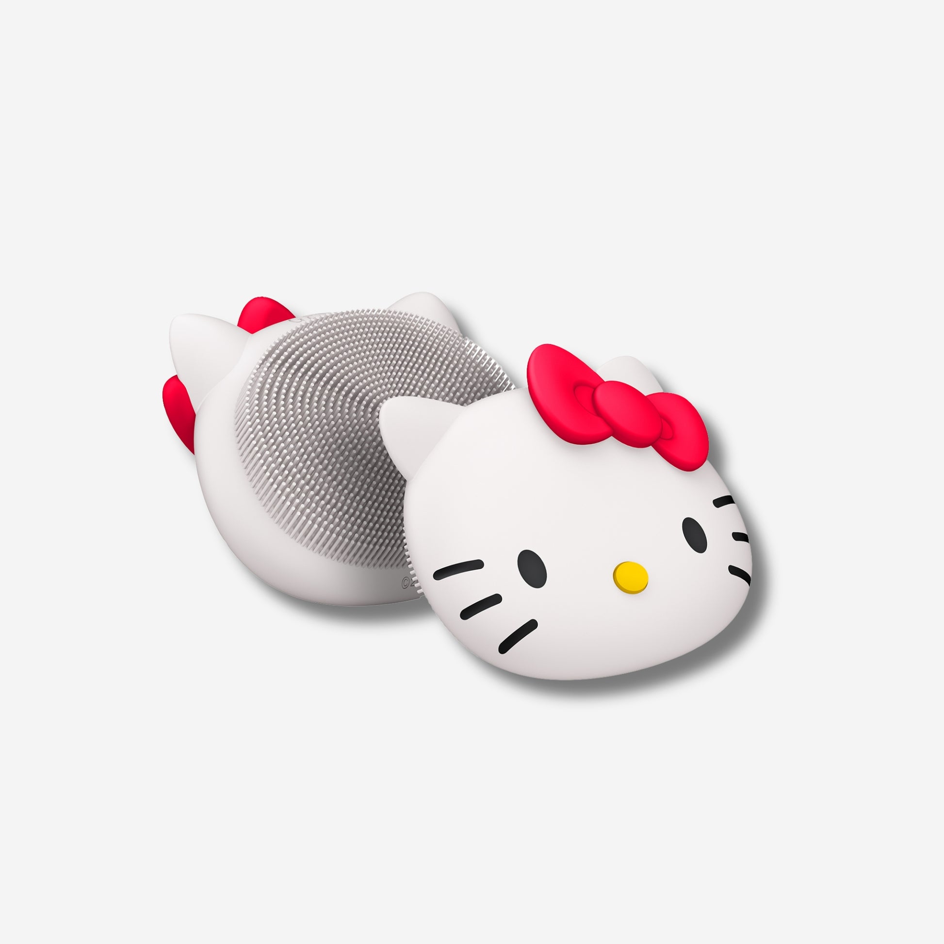 Hello Kitty 3 in 1 facial brush with a cute cat design on a white background.