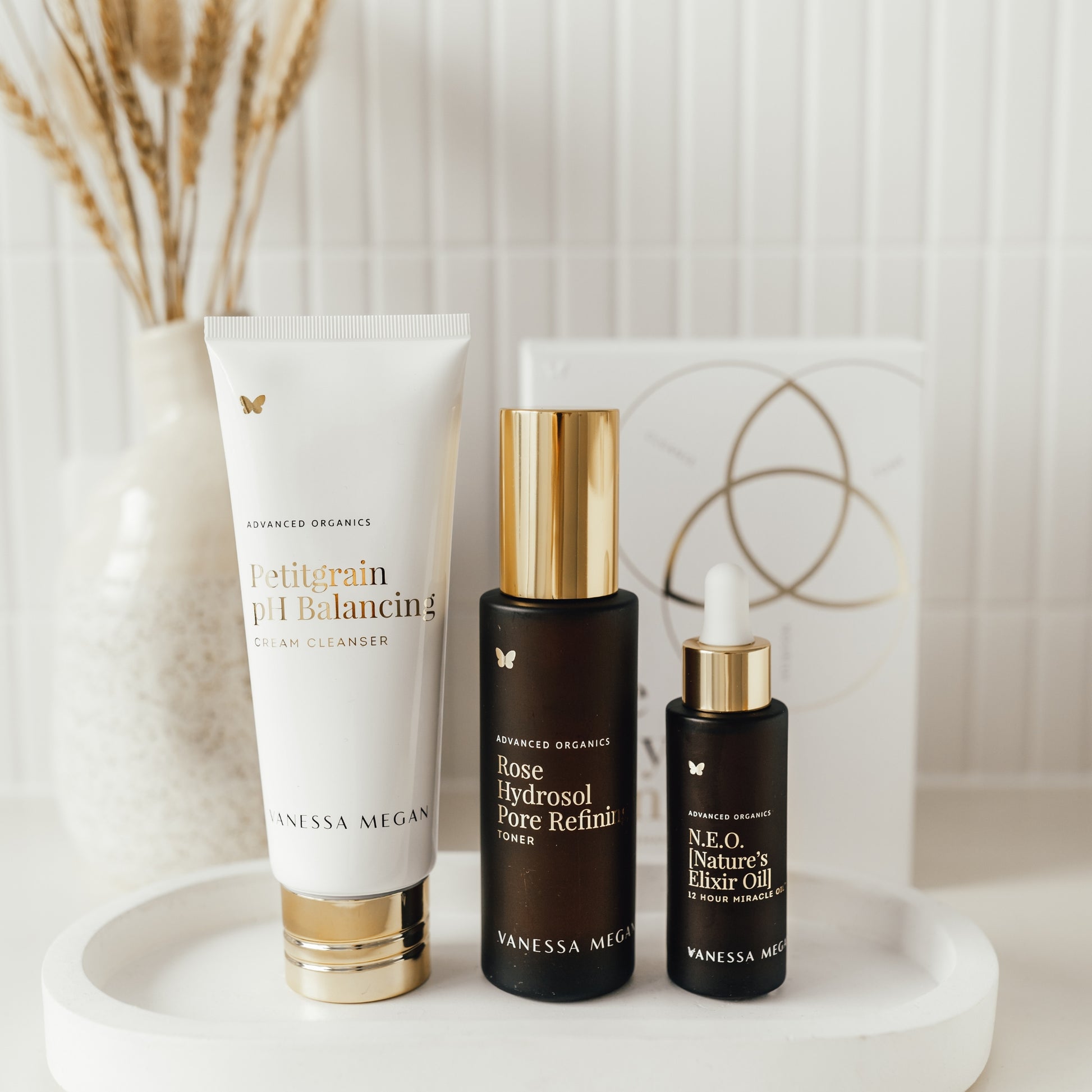 Vanessa Megan The Holy Trinity Set on a white surface with a decorative background