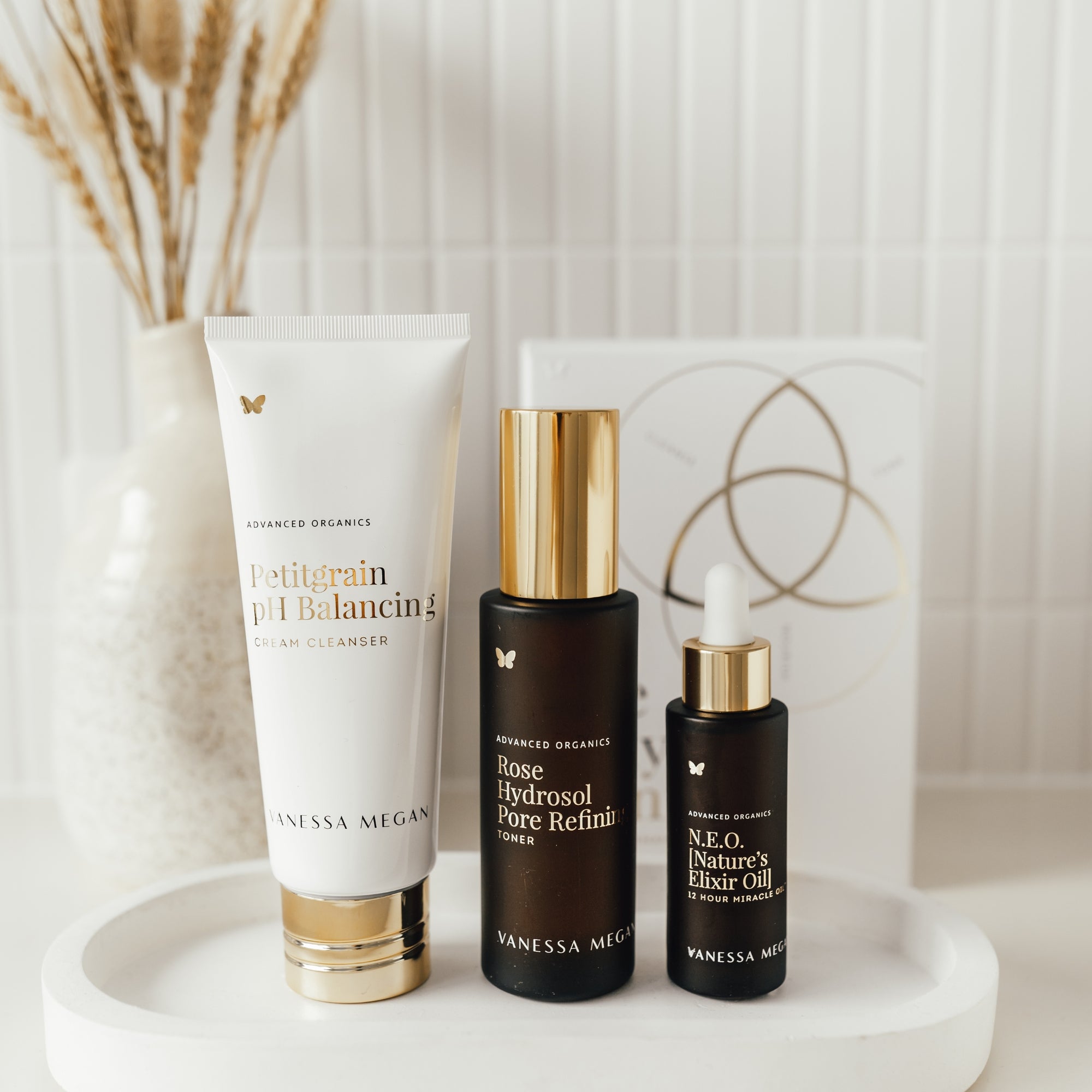 Vanessa Megan The Holy Trinity Set on a white surface with a decorative background