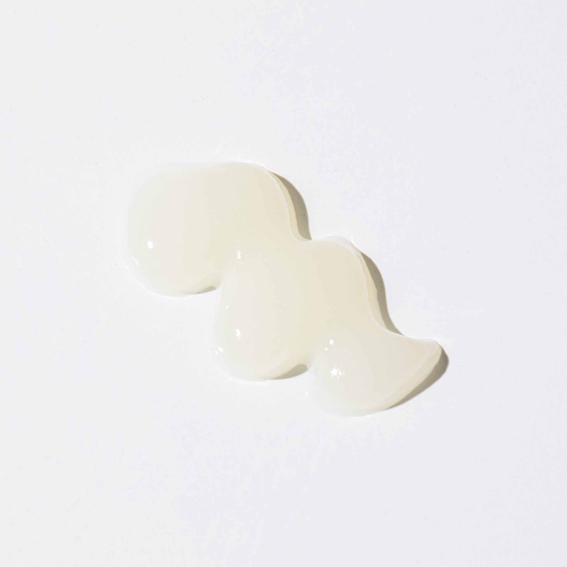 Honest Lip Balm swatch showing smooth, glossy texture on a white background.