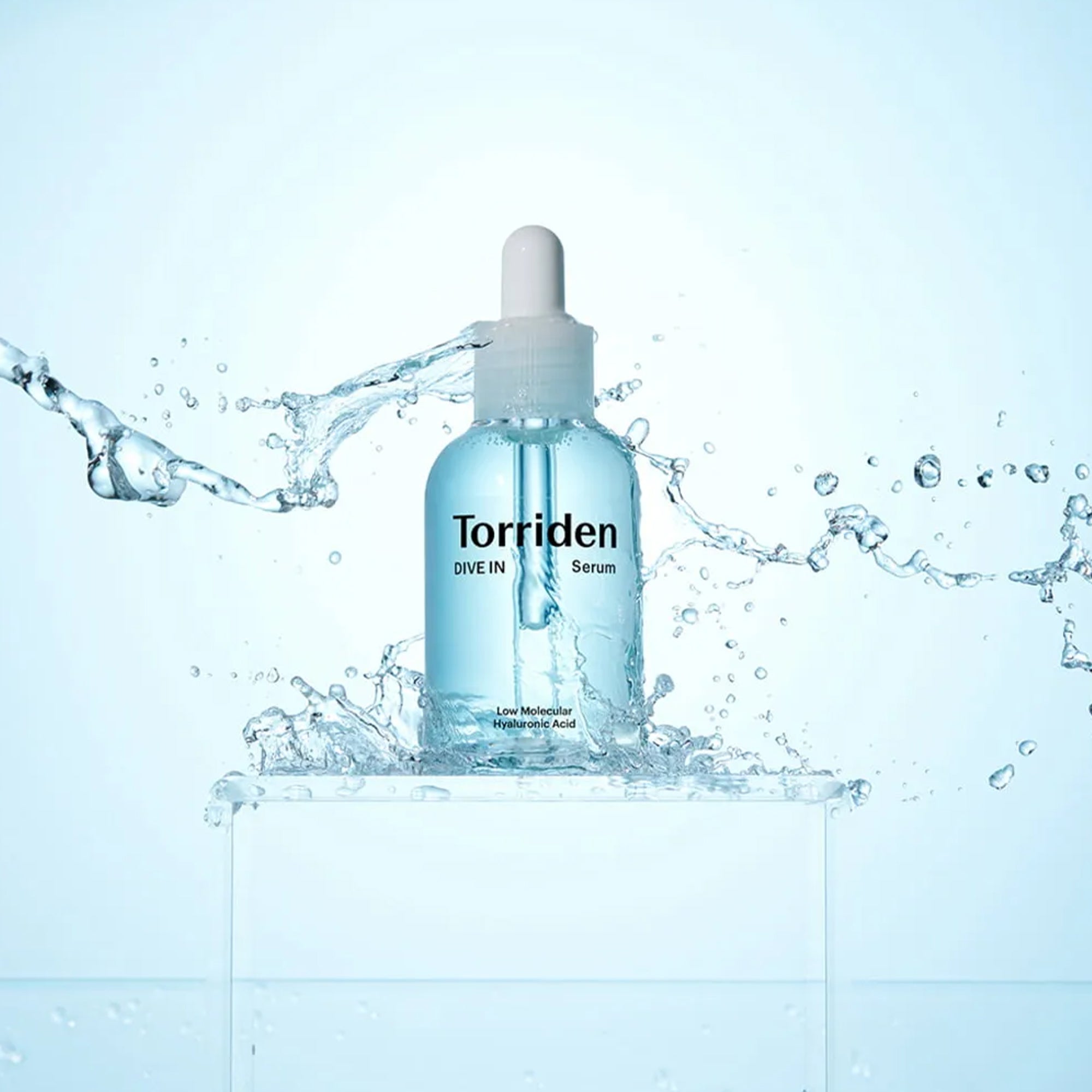 Torriden DIVE-IN Low Molecular Hyaluronic Acid Serum with water splash background.