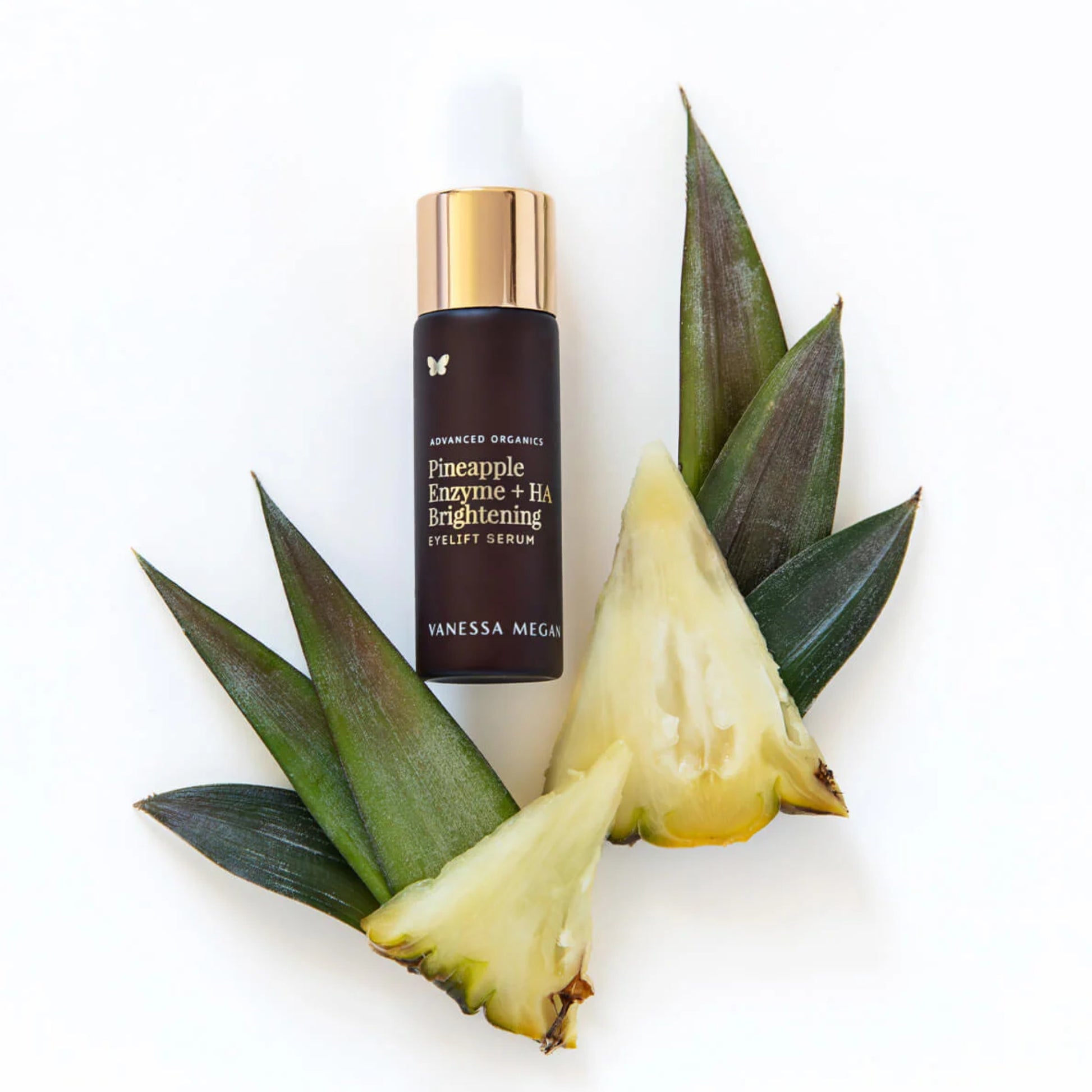 Vanessa Megan Pineapple Enzyme + HA Brightening Eyelift Serum with pineapple and leaves on a white background