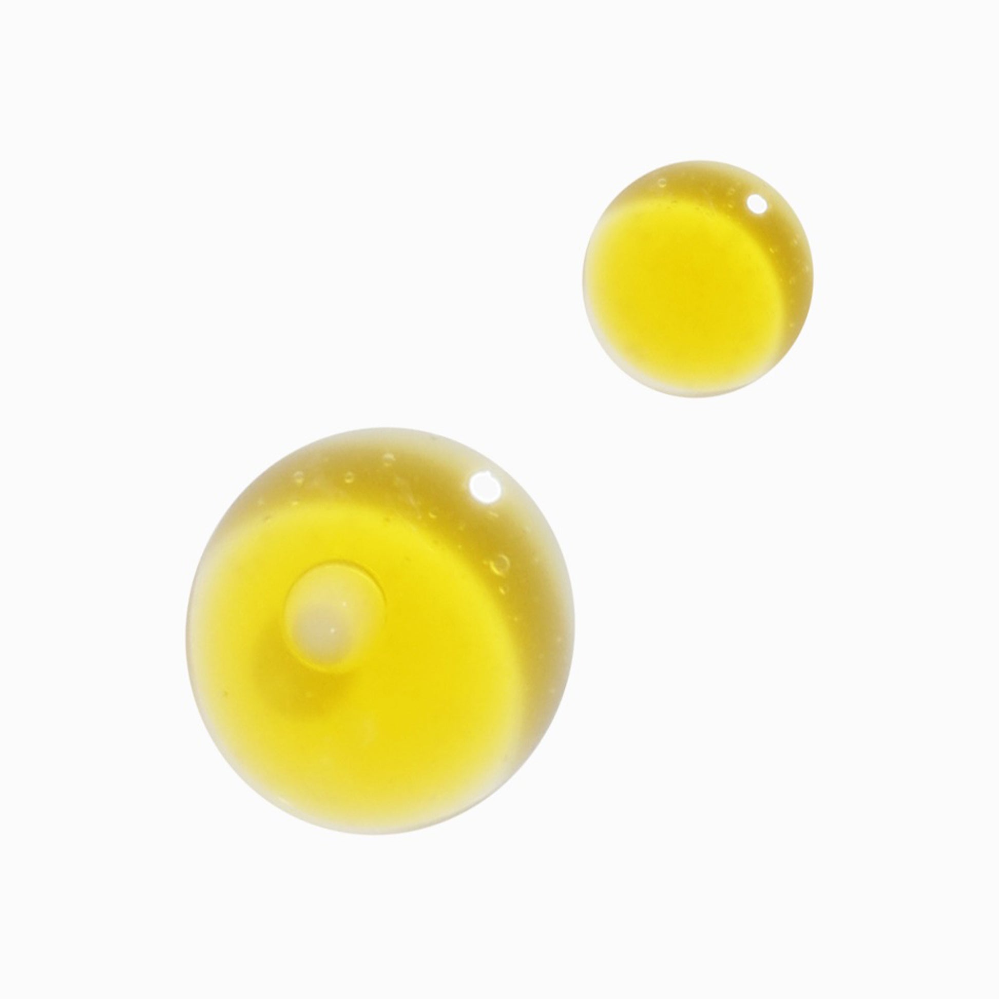 Yellow serum droplets on white background, representing Sioris Time Is Running Out Mist.