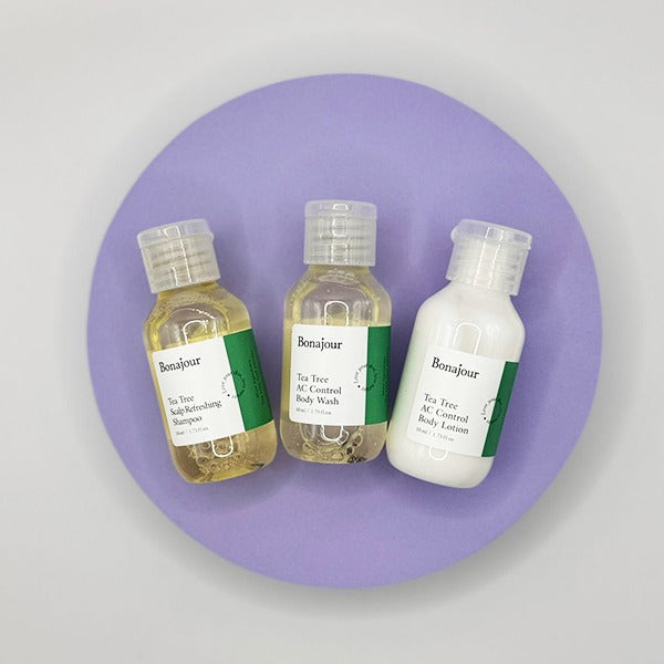 Bonajour Tea Tree AC Control Body Lotion and two bottles on purple background