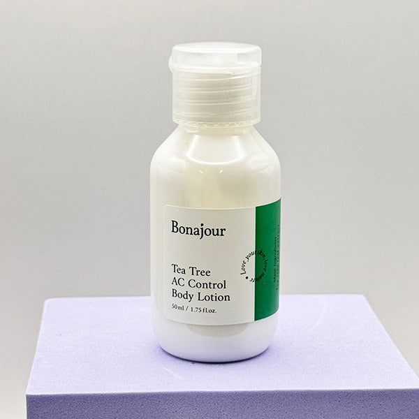 Bonajour Tea Tree AC Control Body Lotion bottle on a purple surface, 50 ml size.