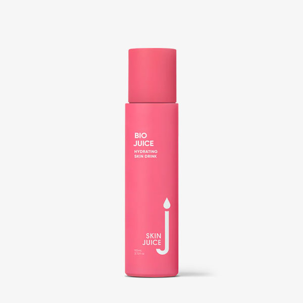 A pink bottle of Bio Juice by Skin Juice, featuring a minimalist design with white text on the label, brings a refreshing touch to your skincare routine as a hydrating skin drink.